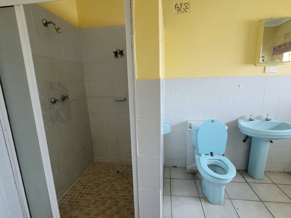Executive Room private bathroom with shower at Afro Lodges & Motels, Borrowdale, Harare